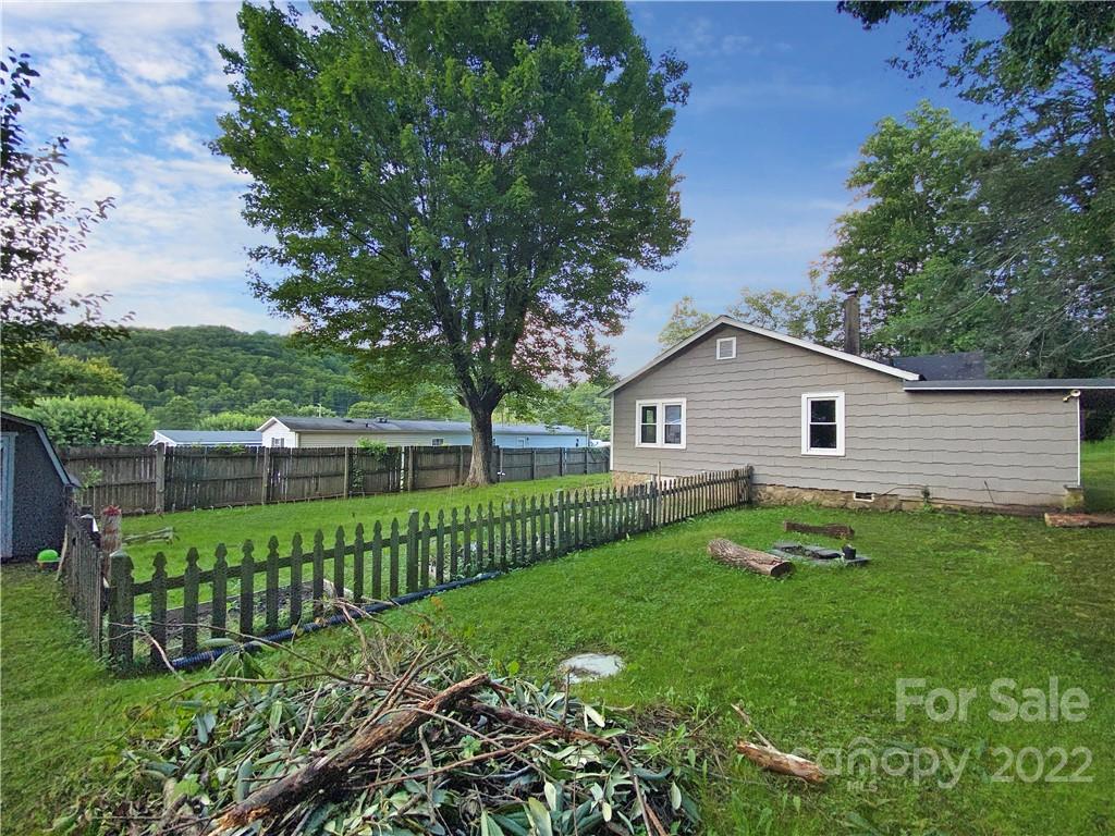 53 Saunook Road Waynesville, NC 28786 - Photo 1 of 10 a view of backyard with garden and trees