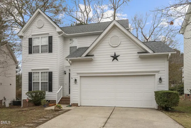 a front view of a house with a garage