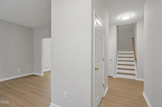 a view of a hallway with stairs
