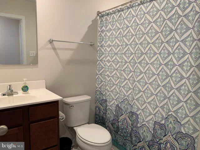 a bathroom with a toilet and a sink