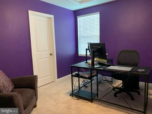 a view of a workspace with furniture