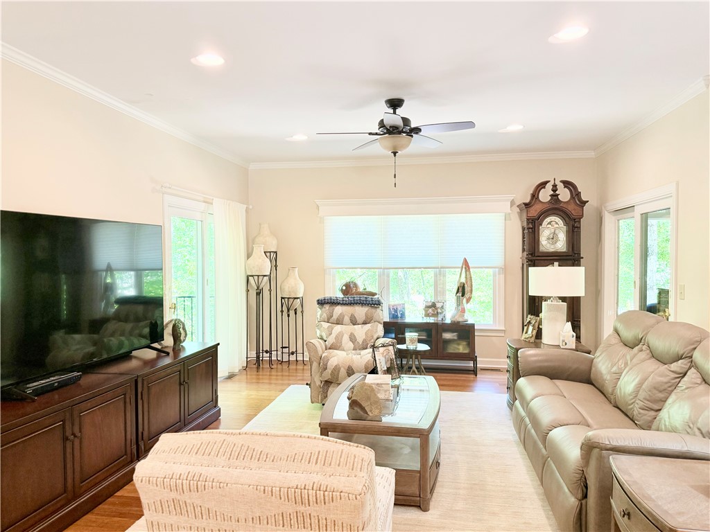 10 Captain Lane Salem, SC 29676 - Photo 12 of 28 This inviting living room features hardwood flooring, crown molding, and abundant natural light.