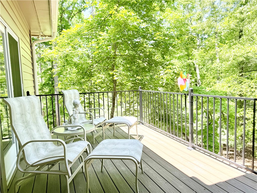 10 Captain Lane Salem, SC 29676 - Photo 14 of 28 Relax on the expansive deck, enjoying tranquil wooded views and serene outdoor living.