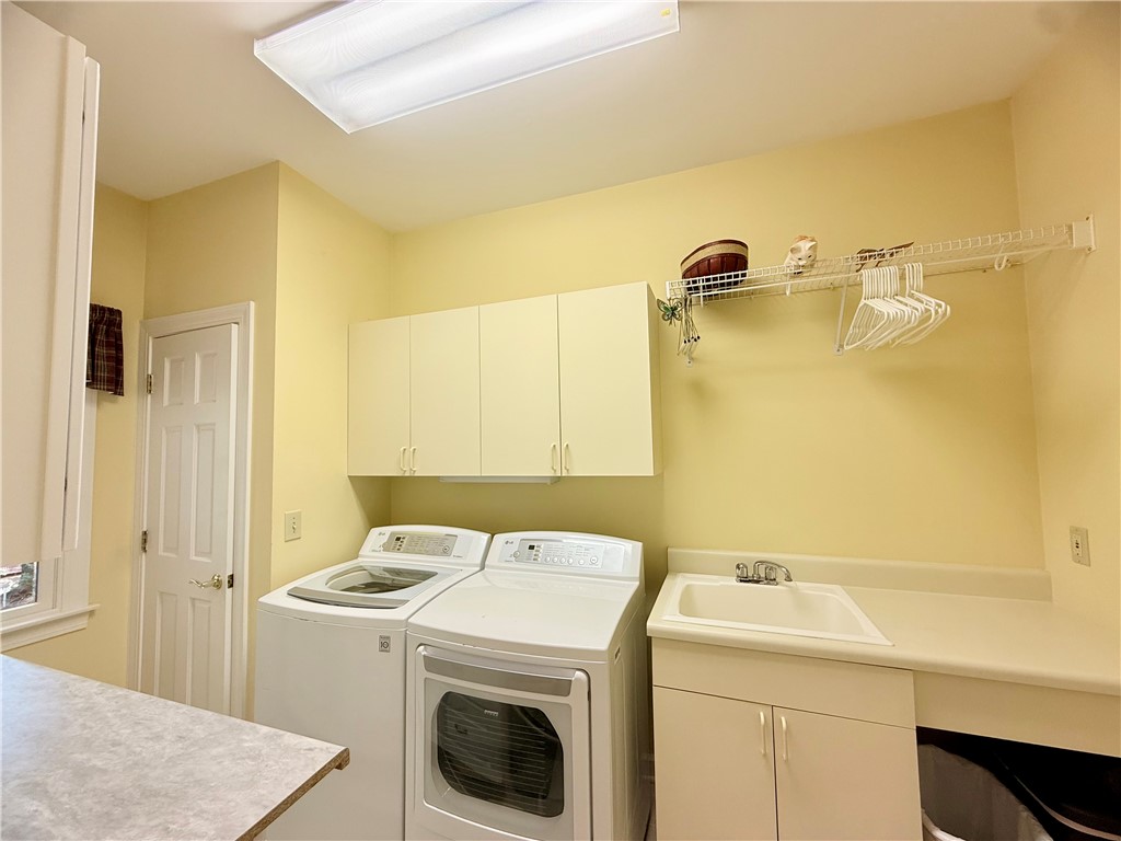 10 Captain Lane Salem, SC 29676 - Photo 17 of 28 This functional laundry room features convenient storage and essential appliances for daily tasks.