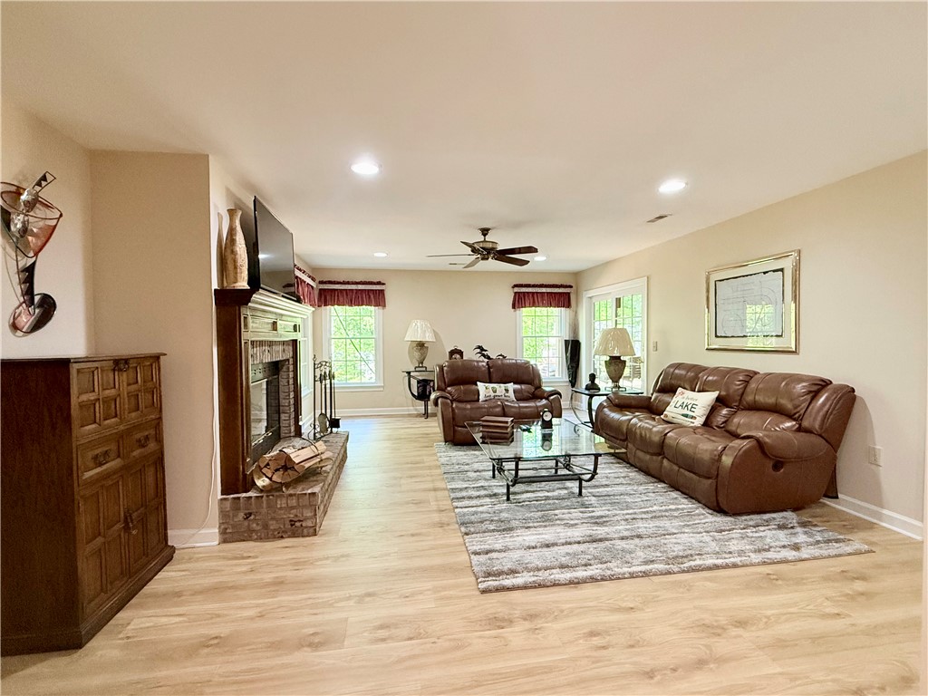 10 Captain Lane Salem, SC 29676 - Photo 18 of 28 This inviting lower level living area boasts rich wood flooring and a cozy fireplace, perfect for relaxing evenings.