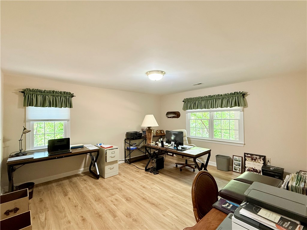 10 Captain Lane Salem, SC 29676 - Photo 21 of 28 This spacious lower level guest bedroom with large walk-in closet could also be used as an office space, and offers ample natural light and a serene view of the outdoors.