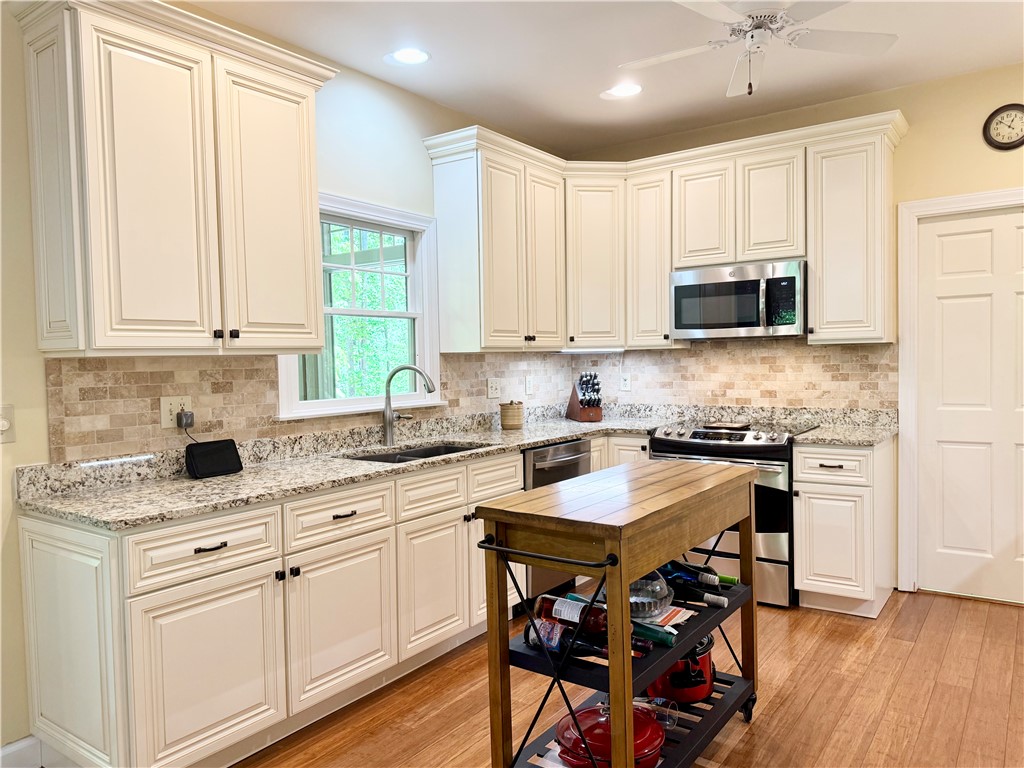 10 Captain Lane Salem, SC 29676 - Photo 4 of 28 This spacious kitchen offers ample cabinet space and modern appliances, perfect for everyday living.