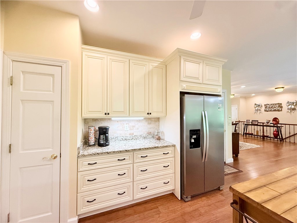 10 Captain Lane Salem, SC 29676 - Photo 5 of 28 This bright kitchen features ample cabinetry and a stainless steel refrigerator, perfect for culinary endeavors.
