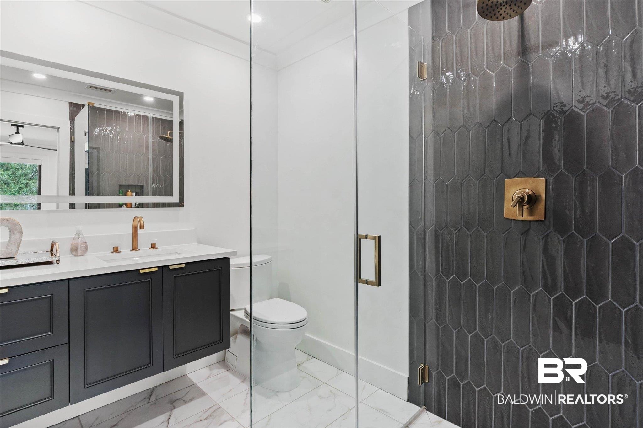 69 Jordan Lane Mobile, AL 36608 - Photo 32 of 57 Full bathroom featuring vanity, a shower stall, crown molding, and light marble finish floors