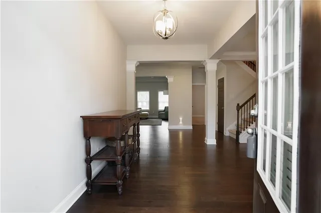 a view of a livingroom with furniture wooden floor and a window