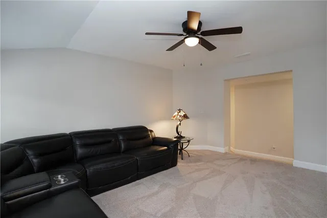 a view of an empty room and closet area