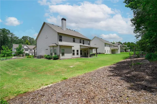 a front view of a house with a plants