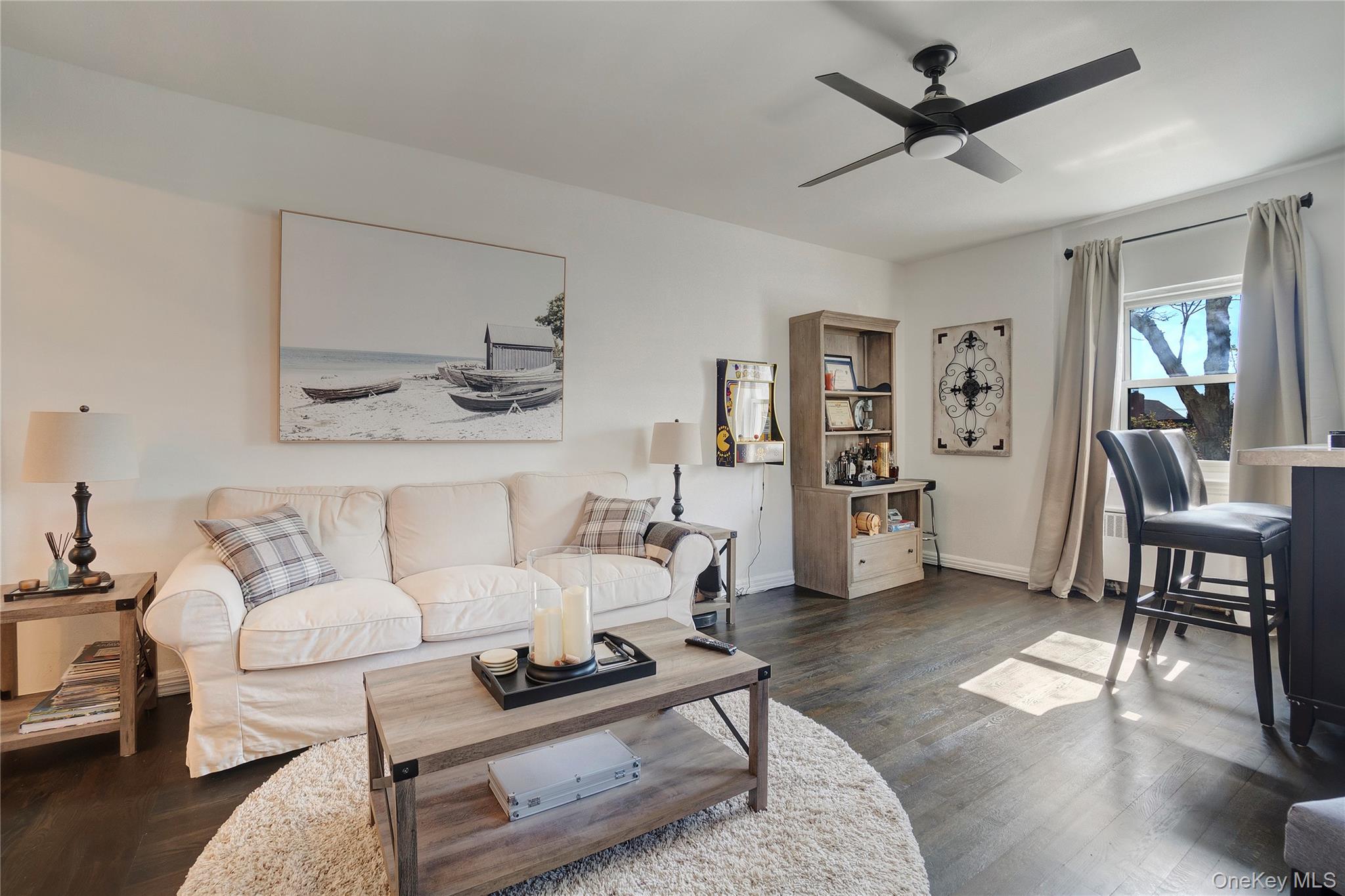 138-11 Beach Channel Drive, Unit C6 Queens, NY 11694 - Photo 1 of 12 a living room with furniture and a wooden floor