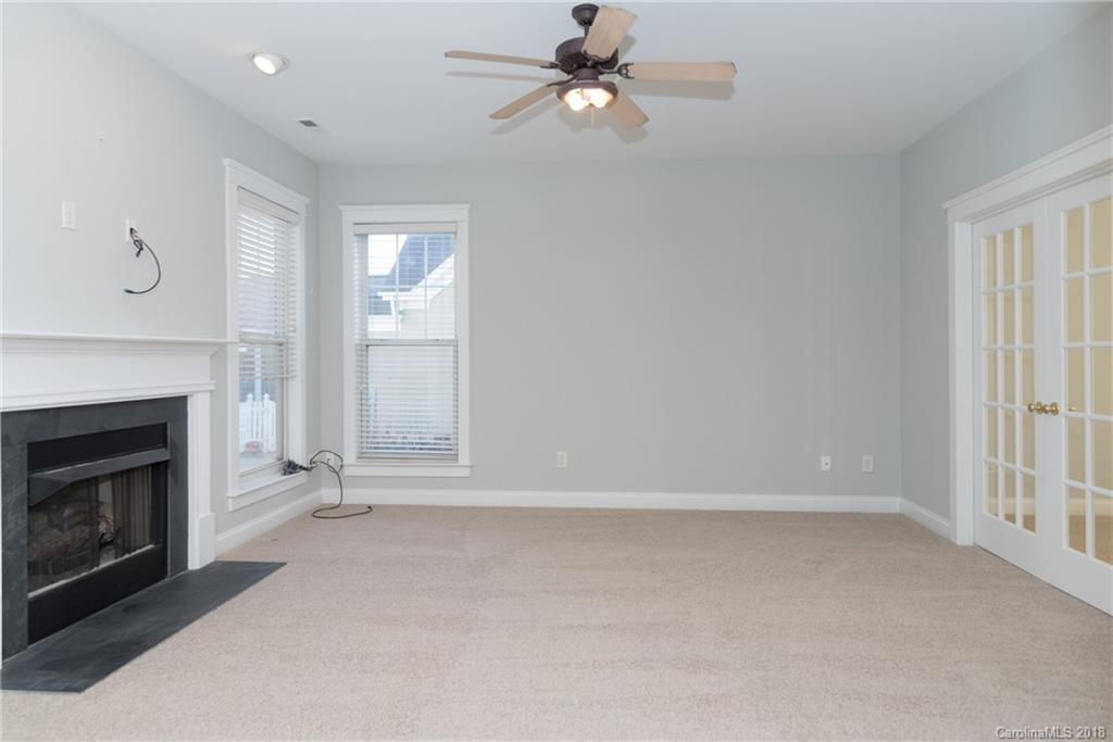 8319 Townley Road Huntersville, NC 28078 - Photo 11 of 17 an empty room with windows and fireplace