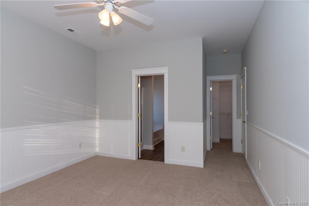 8319 Townley Road Huntersville, NC 28078 - Photo 14 of 17 wooden floor in an empty room with a bathroom