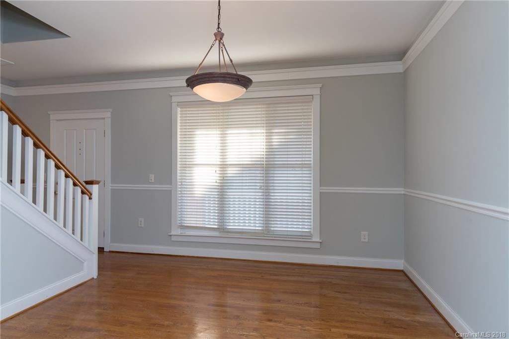 8319 Townley Road Huntersville, NC 28078 - Photo 3 of 17 a view of an empty room with wooden floor and a window