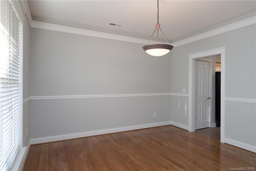 8319 Townley Road Huntersville, NC 28078 - Photo 4 of 17 an empty room with wooden floor and windows