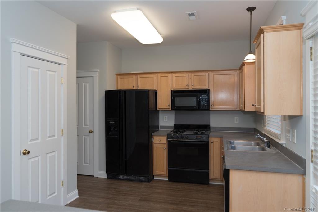 8319 Townley Road Huntersville, NC 28078 - Photo 7 of 17 a kitchen with a refrigerator stove and sink