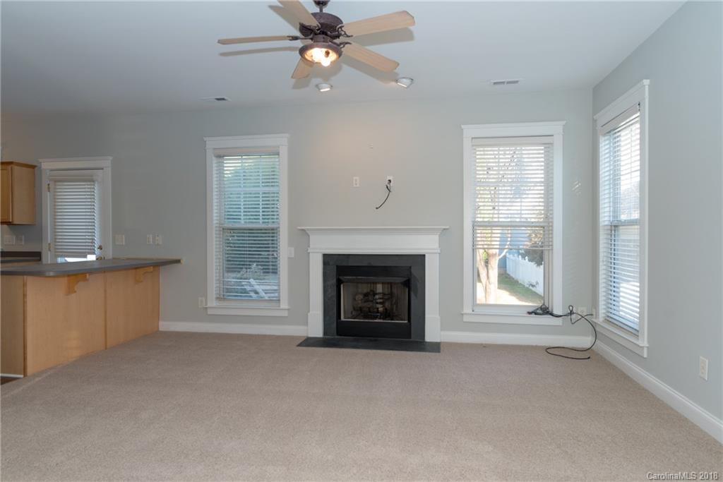 8319 Townley Road Huntersville, NC 28078 - Photo 9 of 17 a view of a livingroom with a fireplace and window