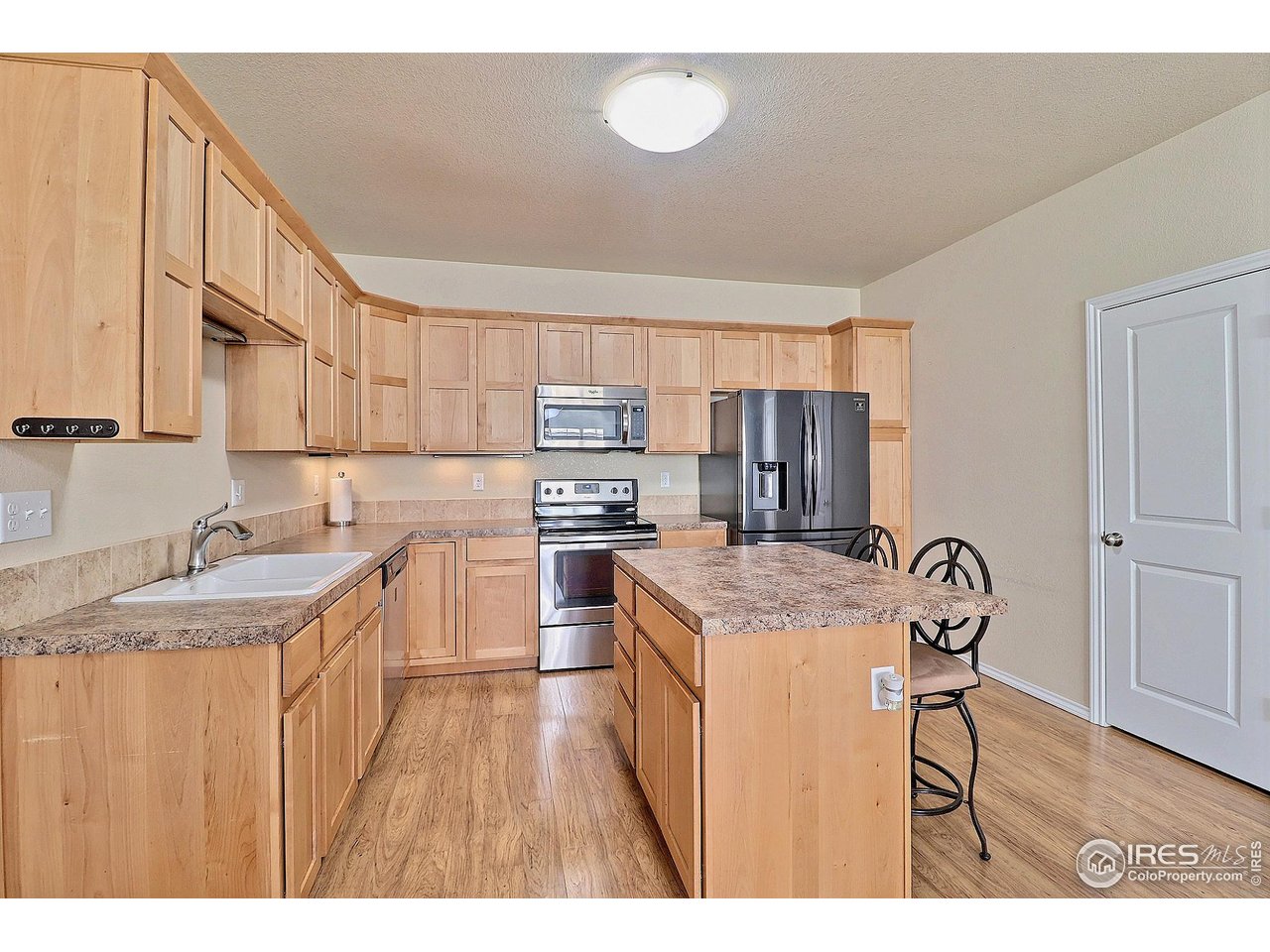 6911 West 3rd Street, Unit 920 Greeley, CO 80634 - Photo 11 of 35 Kitchen Island