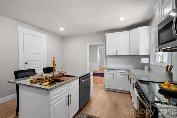 a kitchen with a stove and a sink