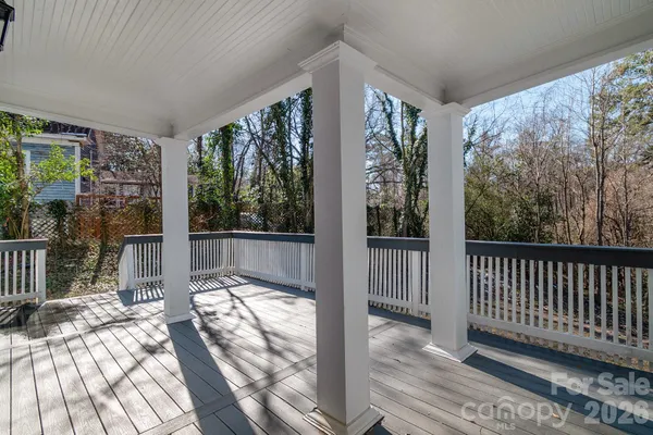 a view of porch with wooden floor