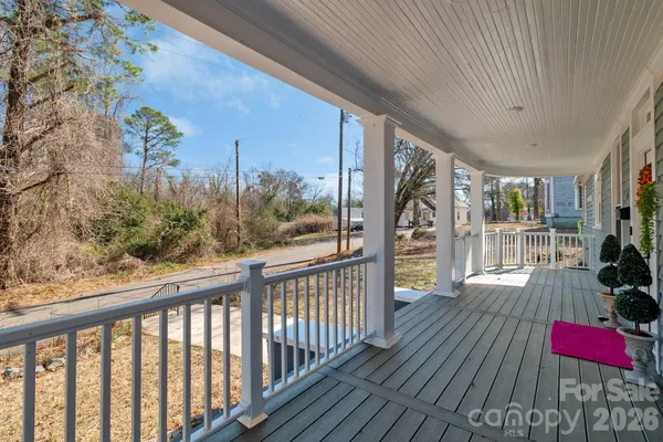 a view of balcony with wooden floor