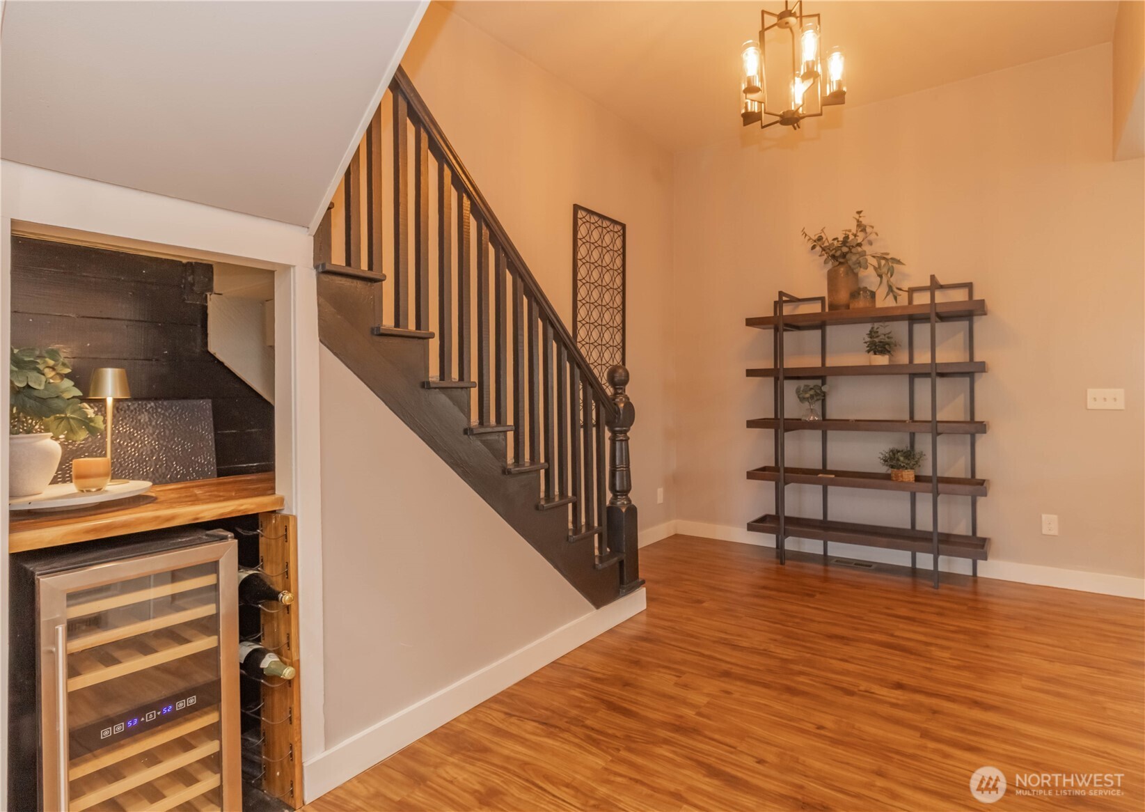 404 Factory Street Southeast Orting, WA 98360 - Photo 15 of 39 a view of a livingroom with wooden floor and stairs