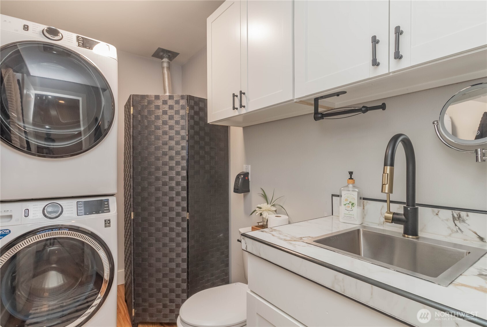 404 Factory Street Southeast Orting, WA 98360 - Photo 18 of 39 a kitchen with a sink a washer and dryer