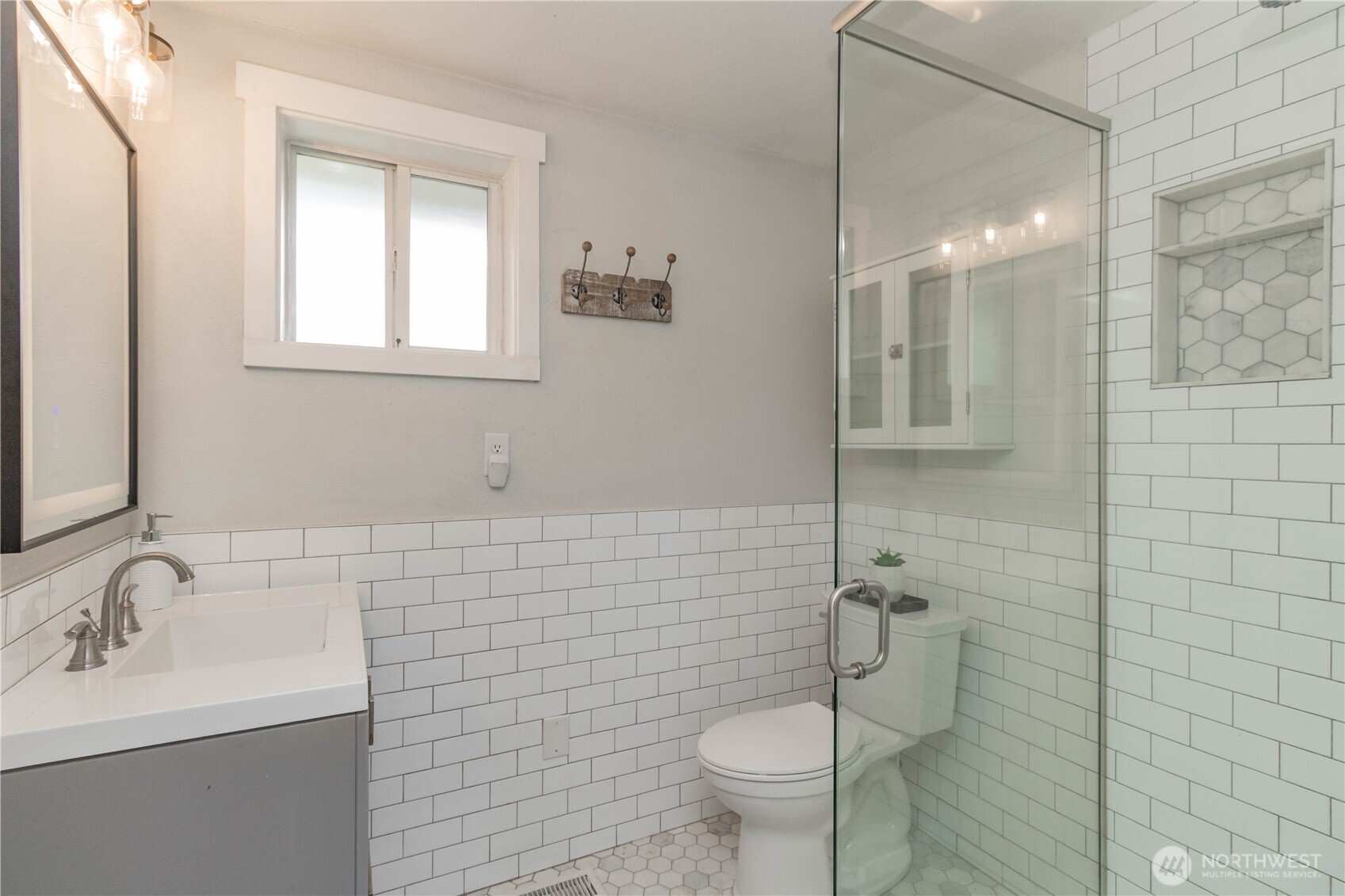 404 Factory Street Southeast Orting, WA 98360 - Photo 22 of 39 a bathroom with a sink toilet and shower