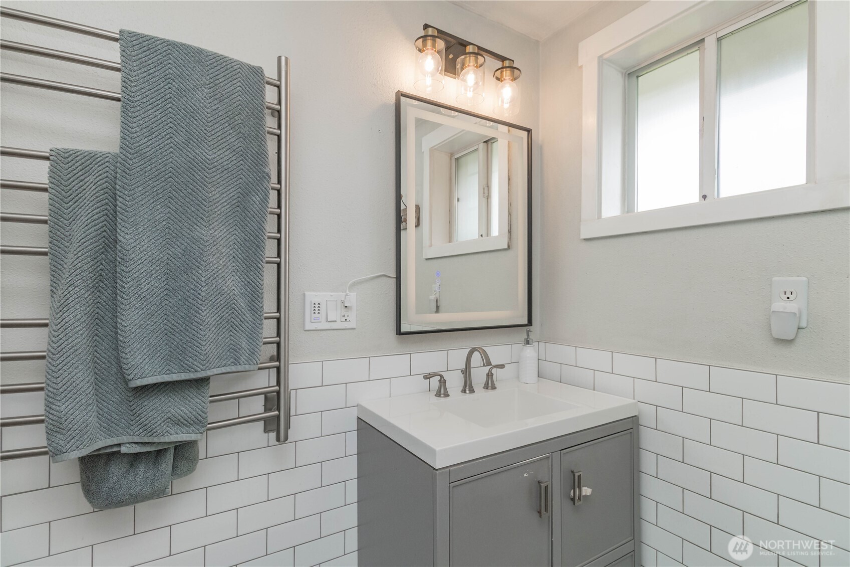404 Factory Street Southeast Orting, WA 98360 - Photo 24 of 39 a bathroom with a sink a toilet and a mirror