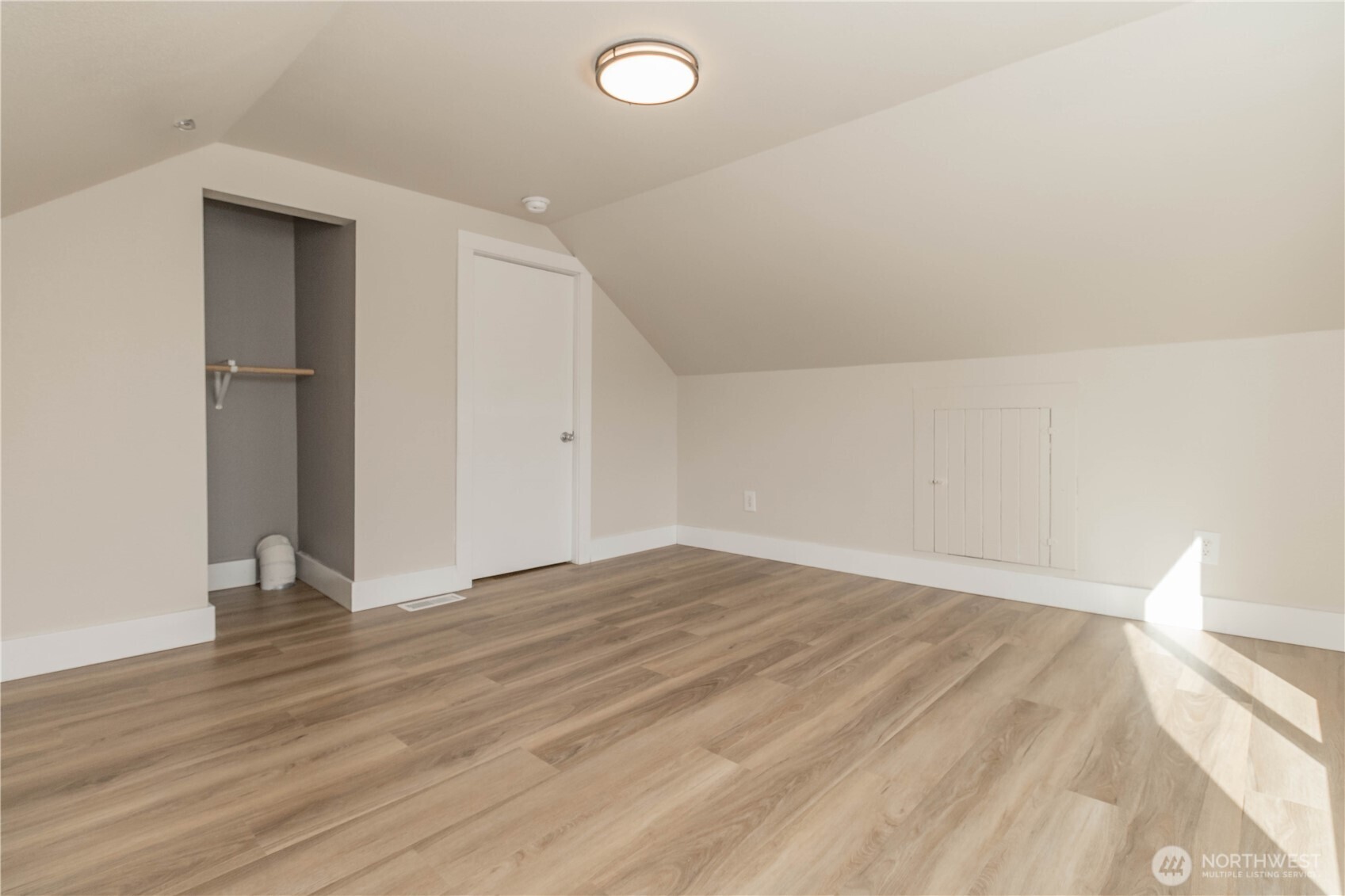 404 Factory Street Southeast Orting, WA 98360 - Photo 28 of 39 a view of an empty room and wooden floor