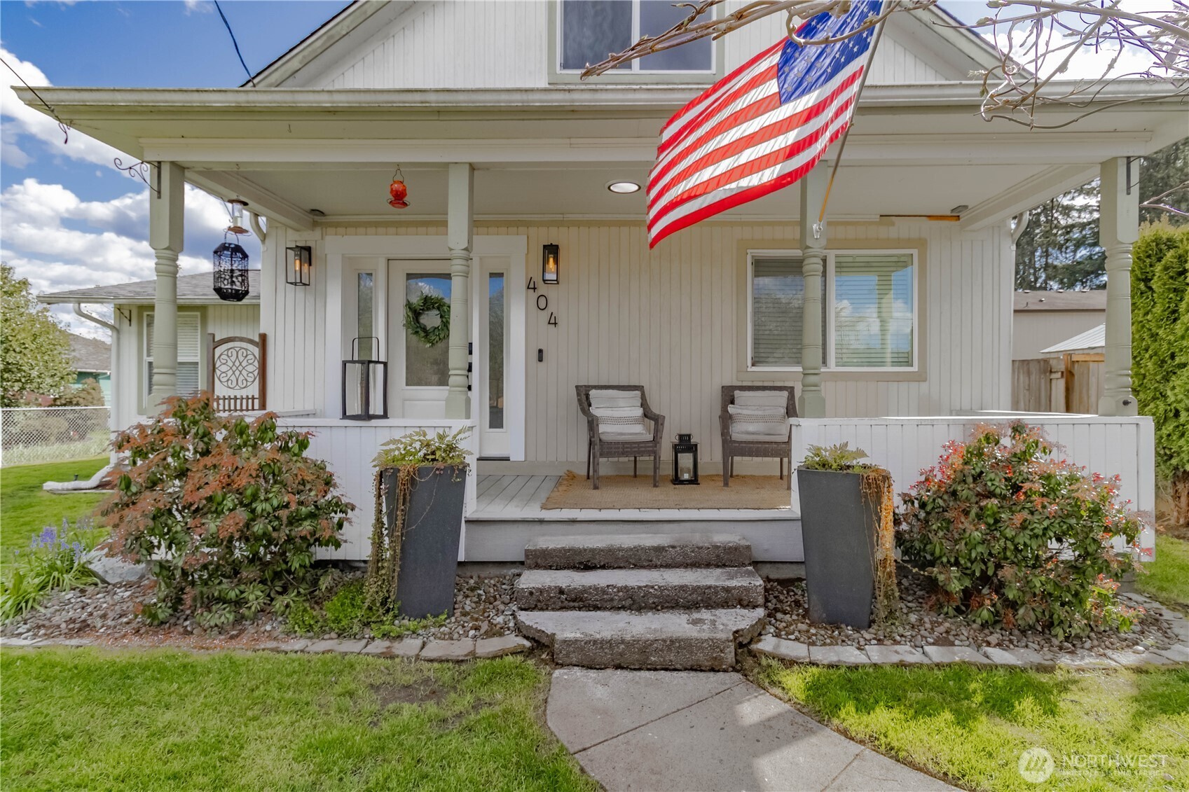 404 Factory Street Southeast Orting, WA 98360 - Photo 3 of 39 a front view of a house with garden