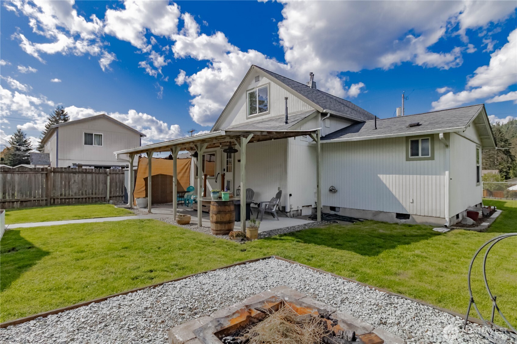 404 Factory Street Southeast Orting, WA 98360 - Photo 33 of 39 a front view of a house with garden