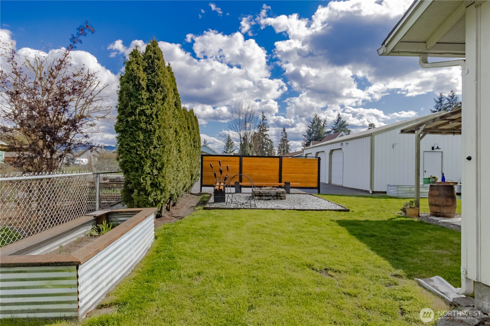 404 Factory Street Southeast Orting, WA 98360 - Photo 34 of 39 a view of a backyard with sitting area