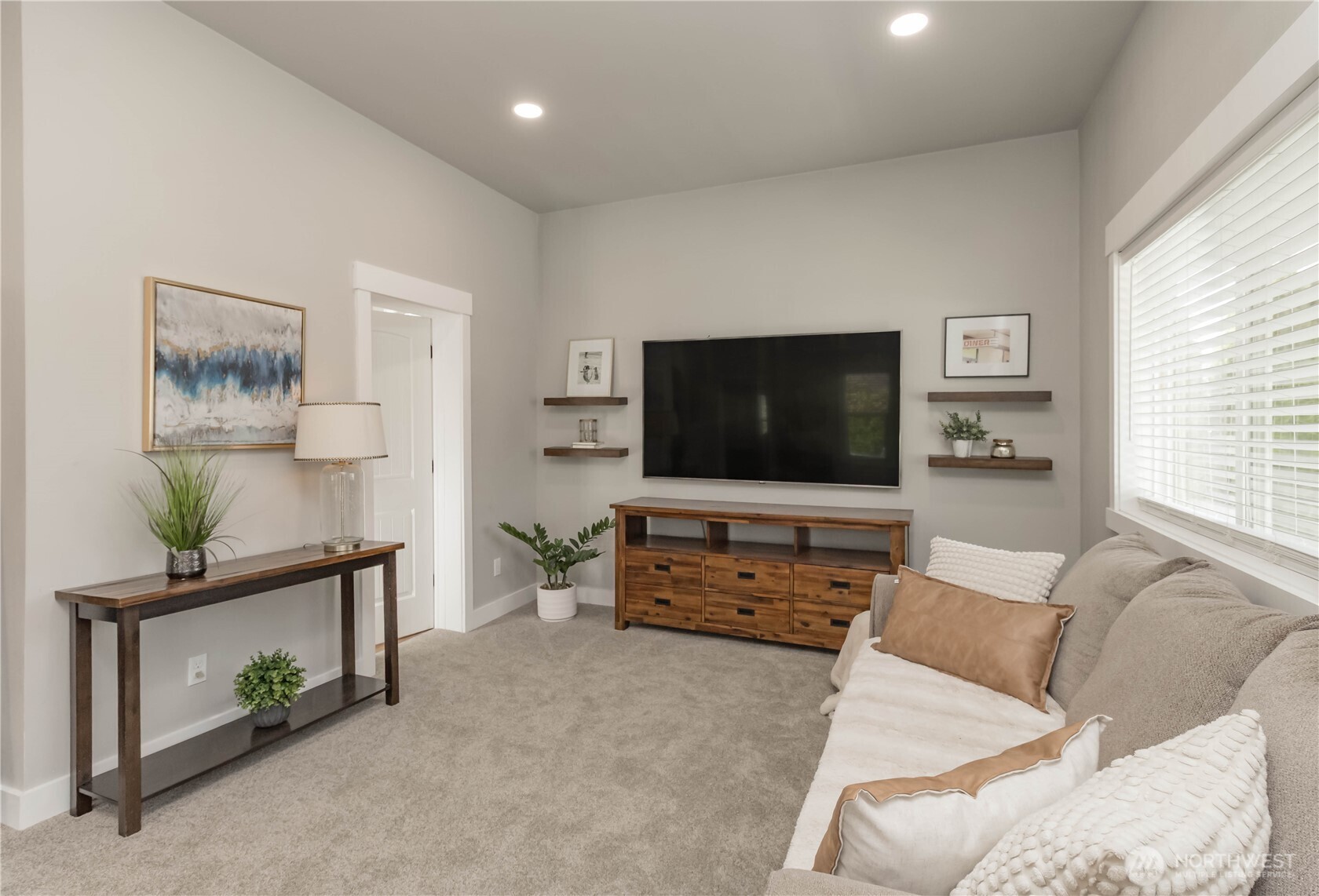 404 Factory Street Southeast Orting, WA 98360 - Photo 7 of 39 a living room with furniture and a flat screen tv