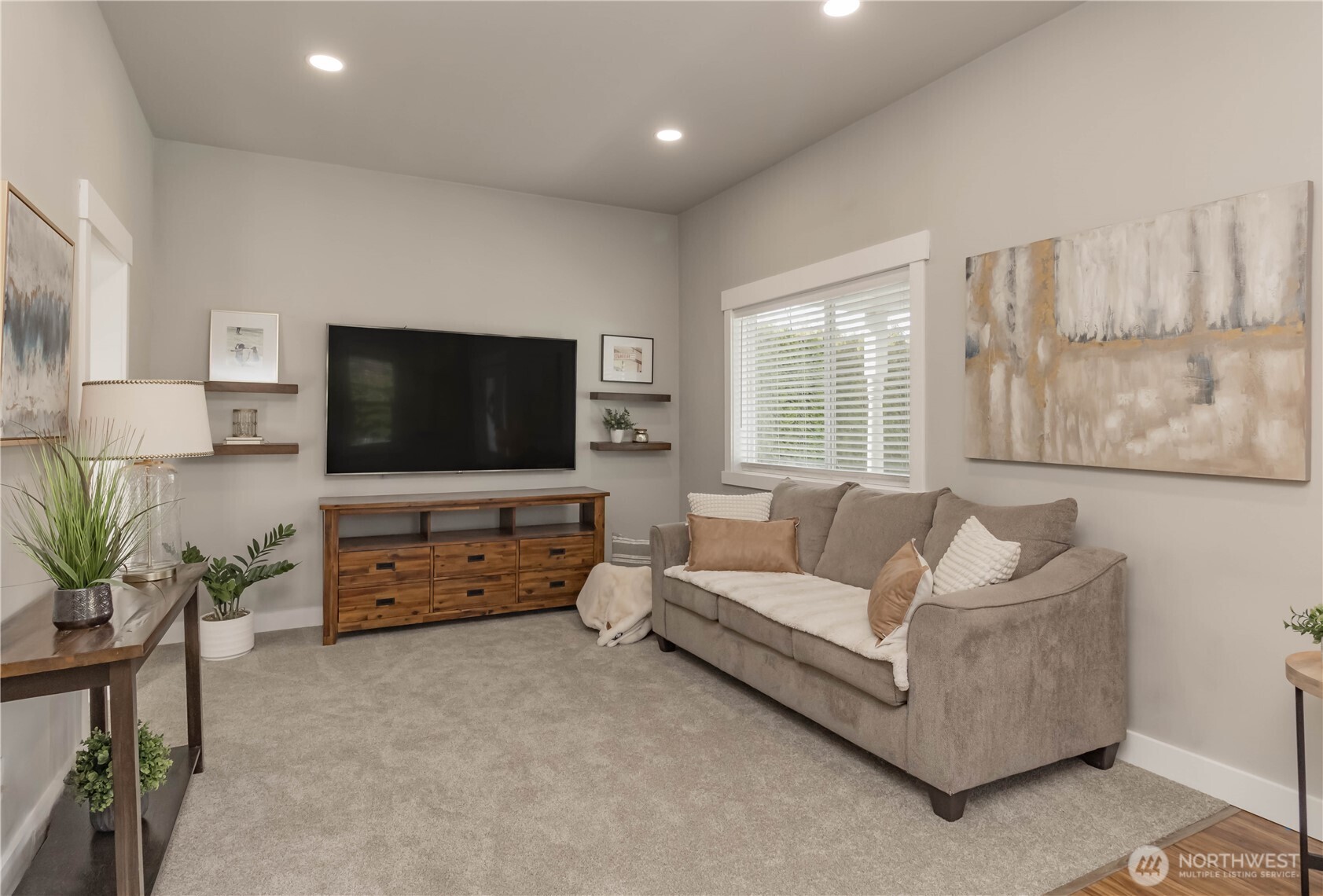 404 Factory Street Southeast Orting, WA 98360 - Photo 8 of 39 a living room with furniture and a flat screen tv