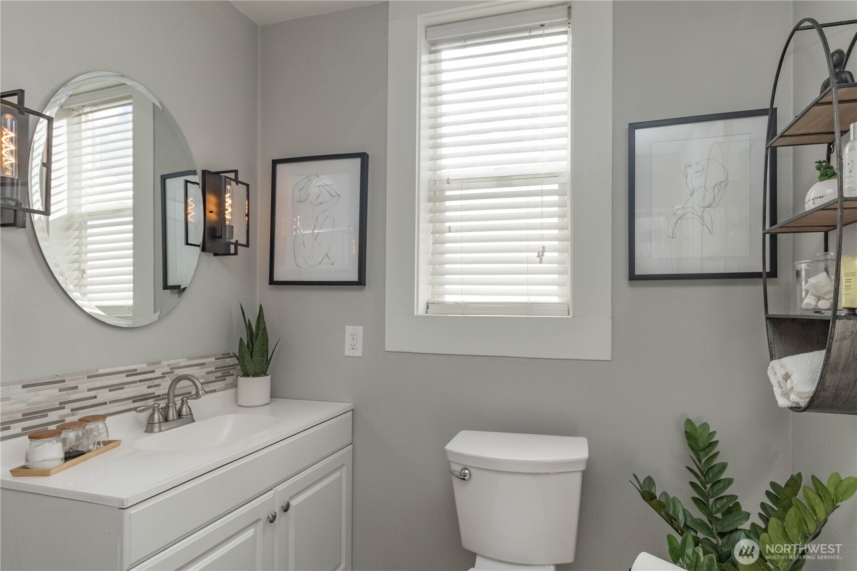 404 Factory Street Southeast Orting, WA 98360 - Photo 9 of 39 a bathroom with a toilet a sink and mirror
