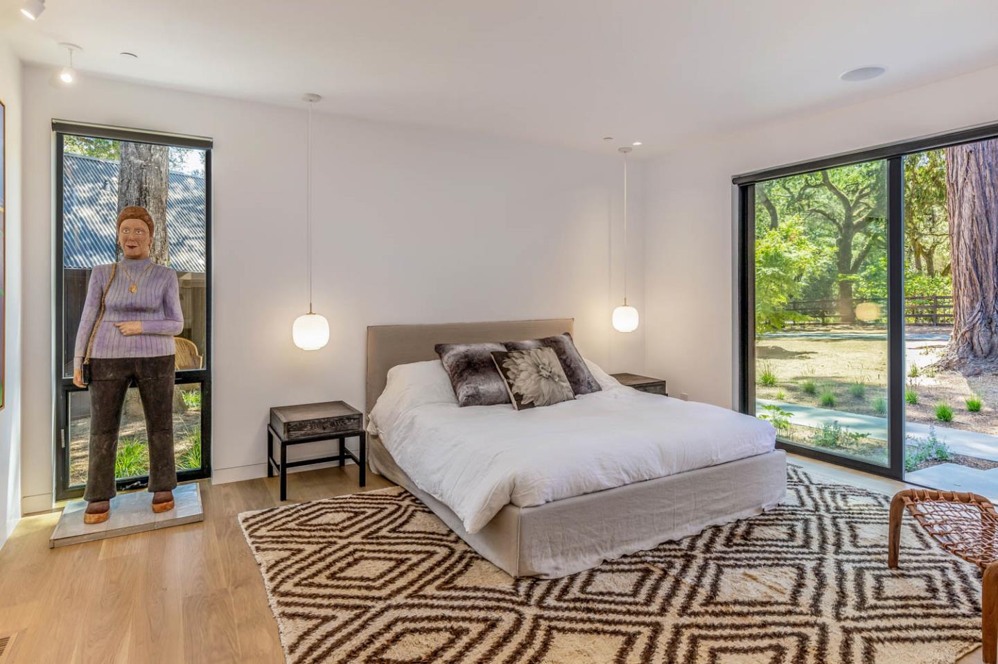 3450 Tripp Road Woodside, CA 94062 - Photo 11 of 27 a bedroom with a large bed and a window