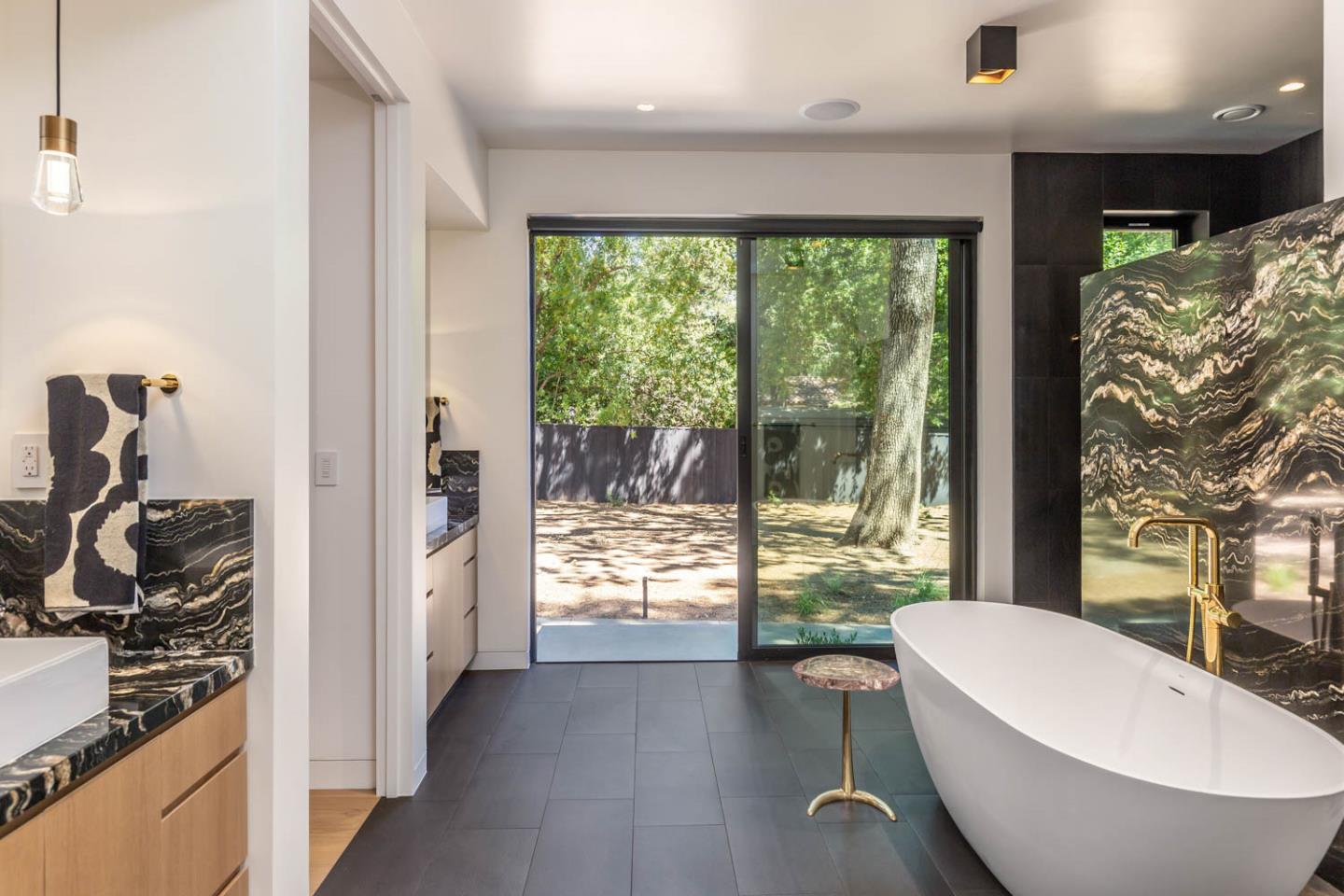 3450 Tripp Road Woodside, CA 94062 - Photo 12 of 27 a bathroom with a bathtub and a large window