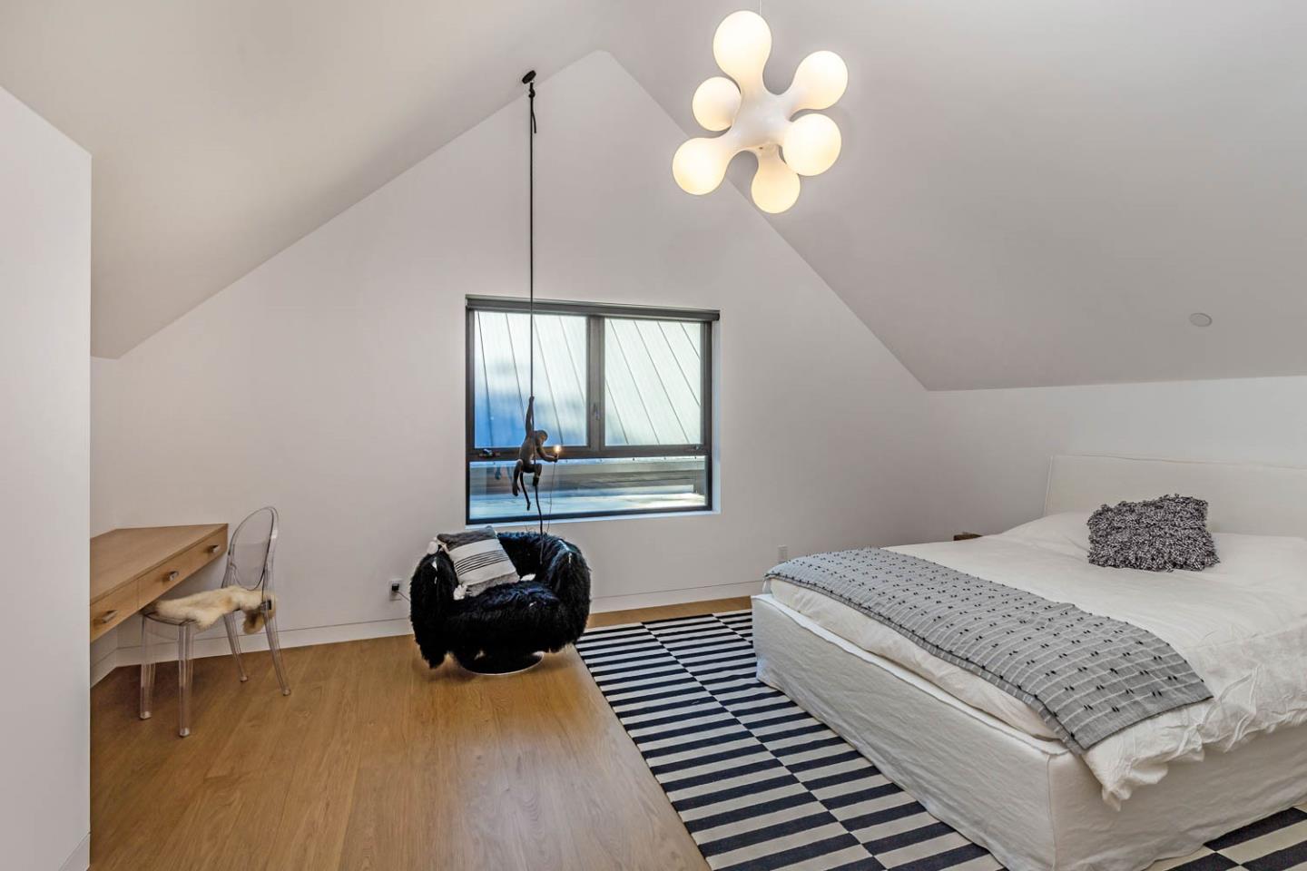 3450 Tripp Road Woodside, CA 94062 - Photo 14 of 27 a bedroom with a bed and ceiling fan