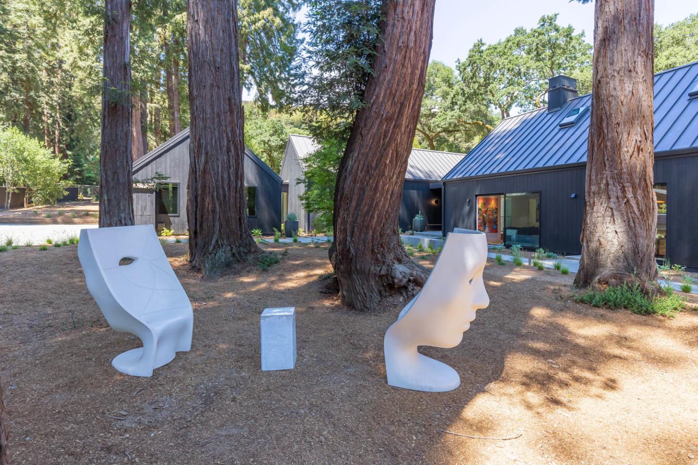 3450 Tripp Road Woodside, CA 94062 - Photo 3 of 27 a view of a wooden chairs and a fire pit