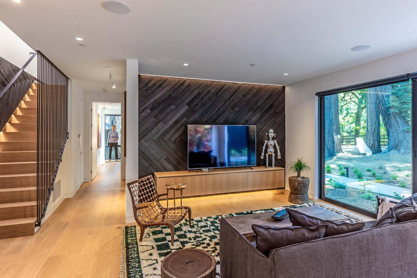 3450 Tripp Road Woodside, CA 94062 - Photo 4 of 27 a living room with a couch and a fireplace