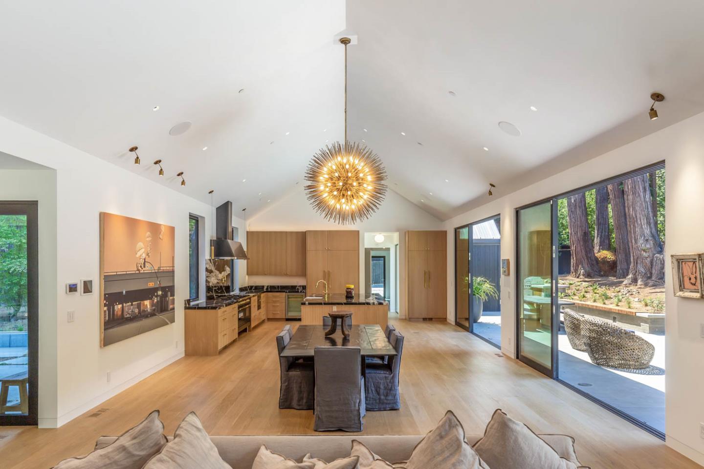 3450 Tripp Road Woodside, CA 94062 - Photo 6 of 27 a living room with furniture kitchen view and large windows