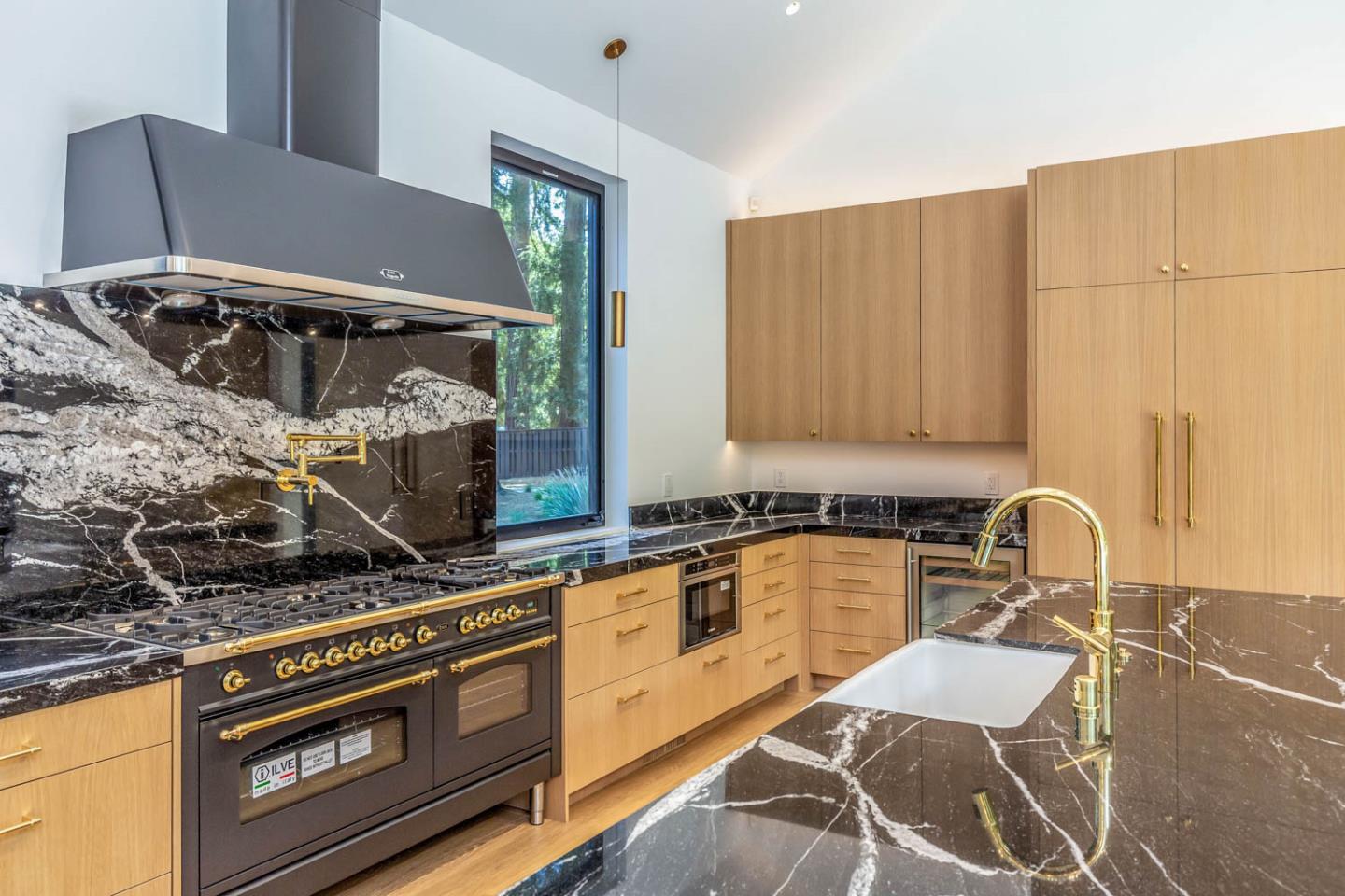 3450 Tripp Road Woodside, CA 94062 - Photo 9 of 27 a kitchen with a stove a sink and a microwave