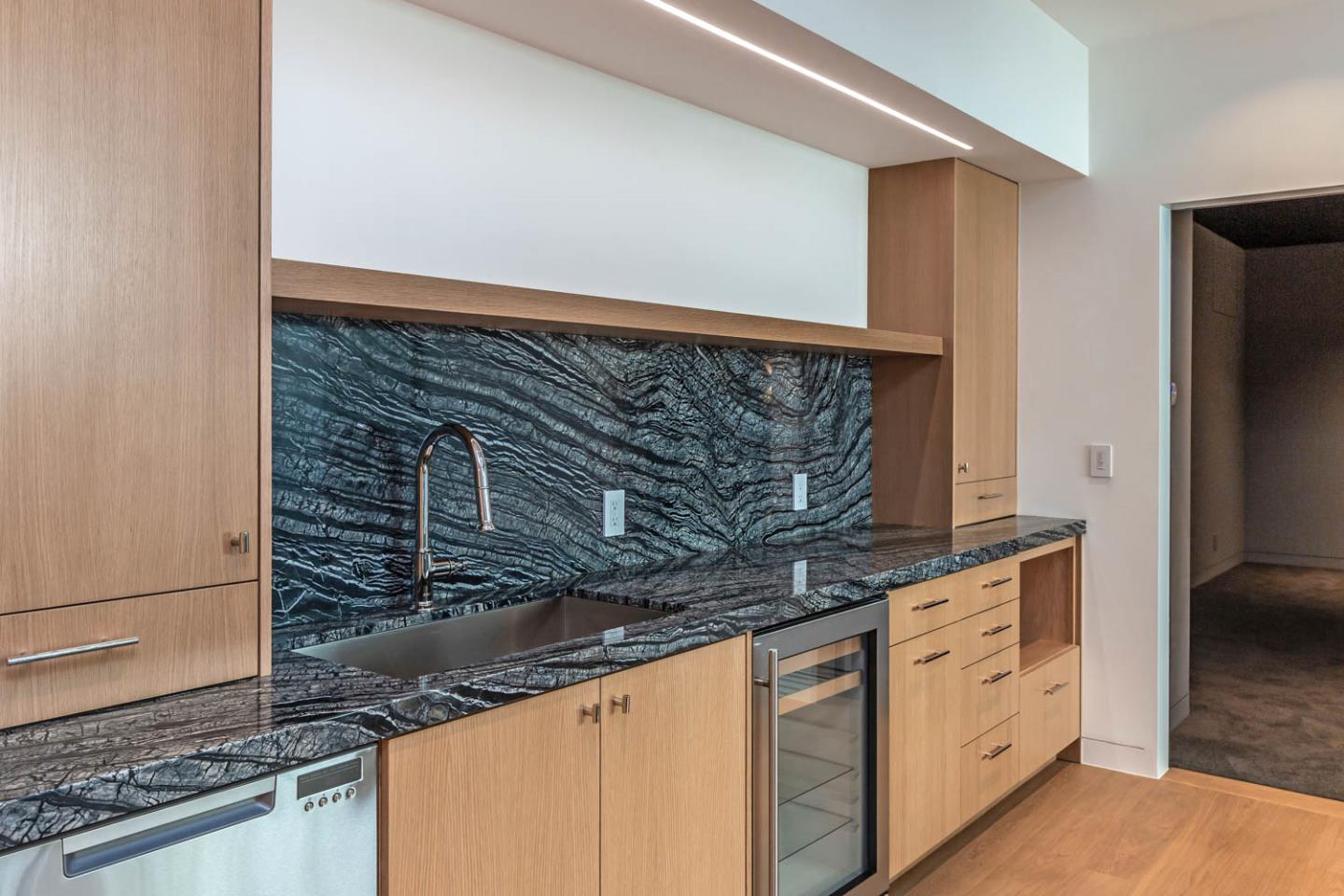 3450 Tripp Road Woodside, CA 94062 - Photo 10 of 27 a kitchen with granite countertop white cabinets and stainless steel appliances