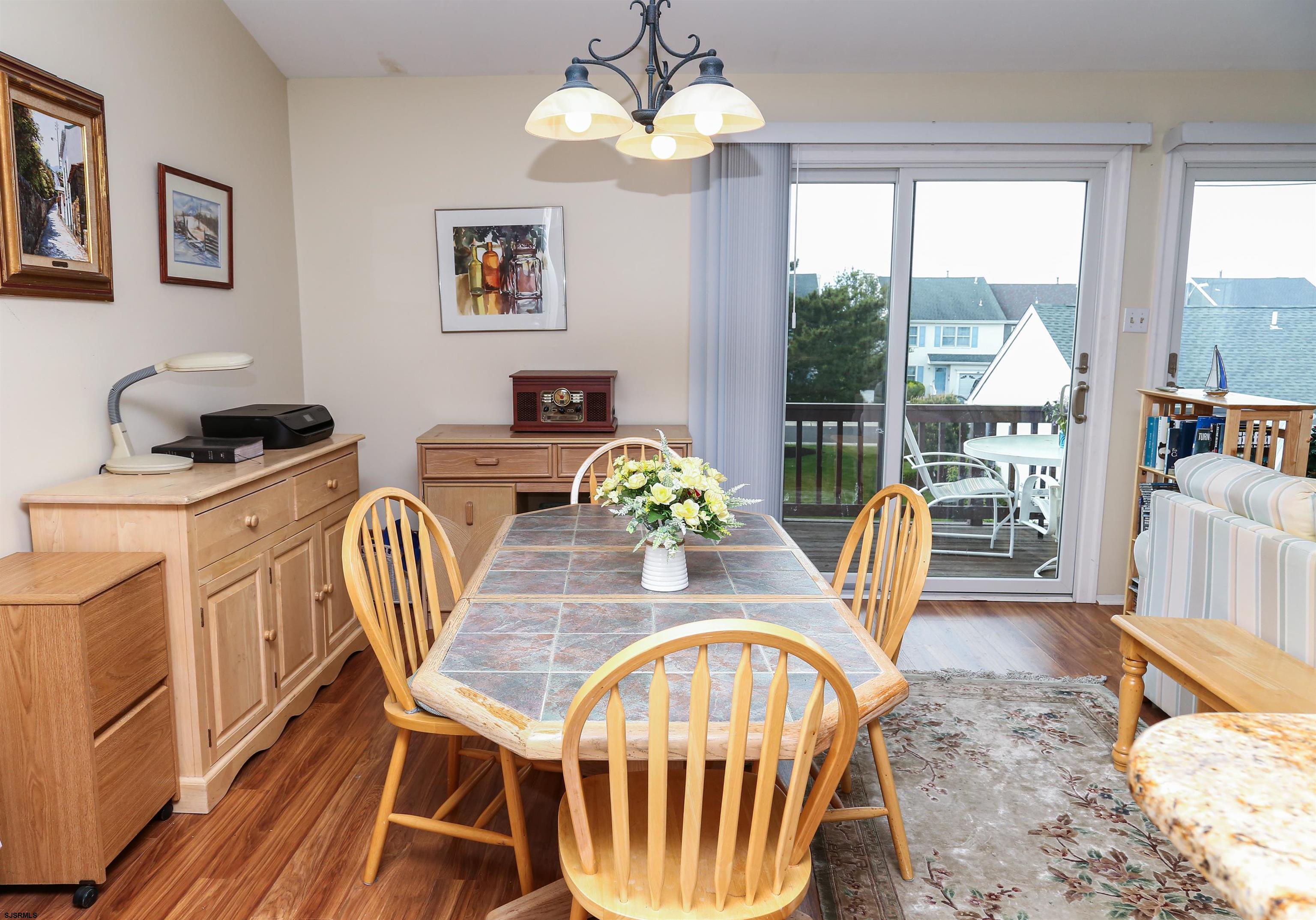340 Seashell Lane Brigantine, NJ 08203 - Photo 16 of 29 a view of a dining room with furniture window and wooden floor