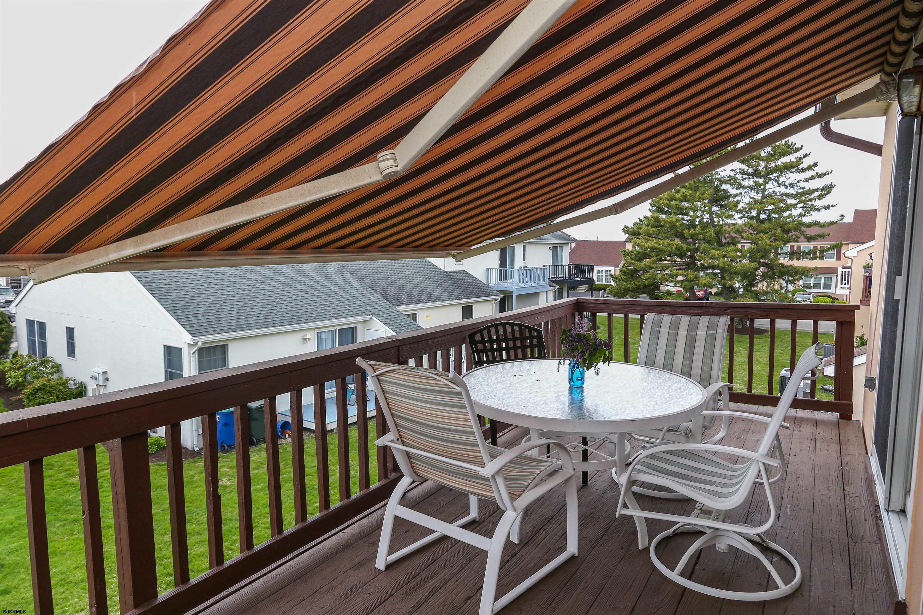 340 Seashell Lane Brigantine, NJ 08203 - Photo 19 of 29 a balcony with table and chairs