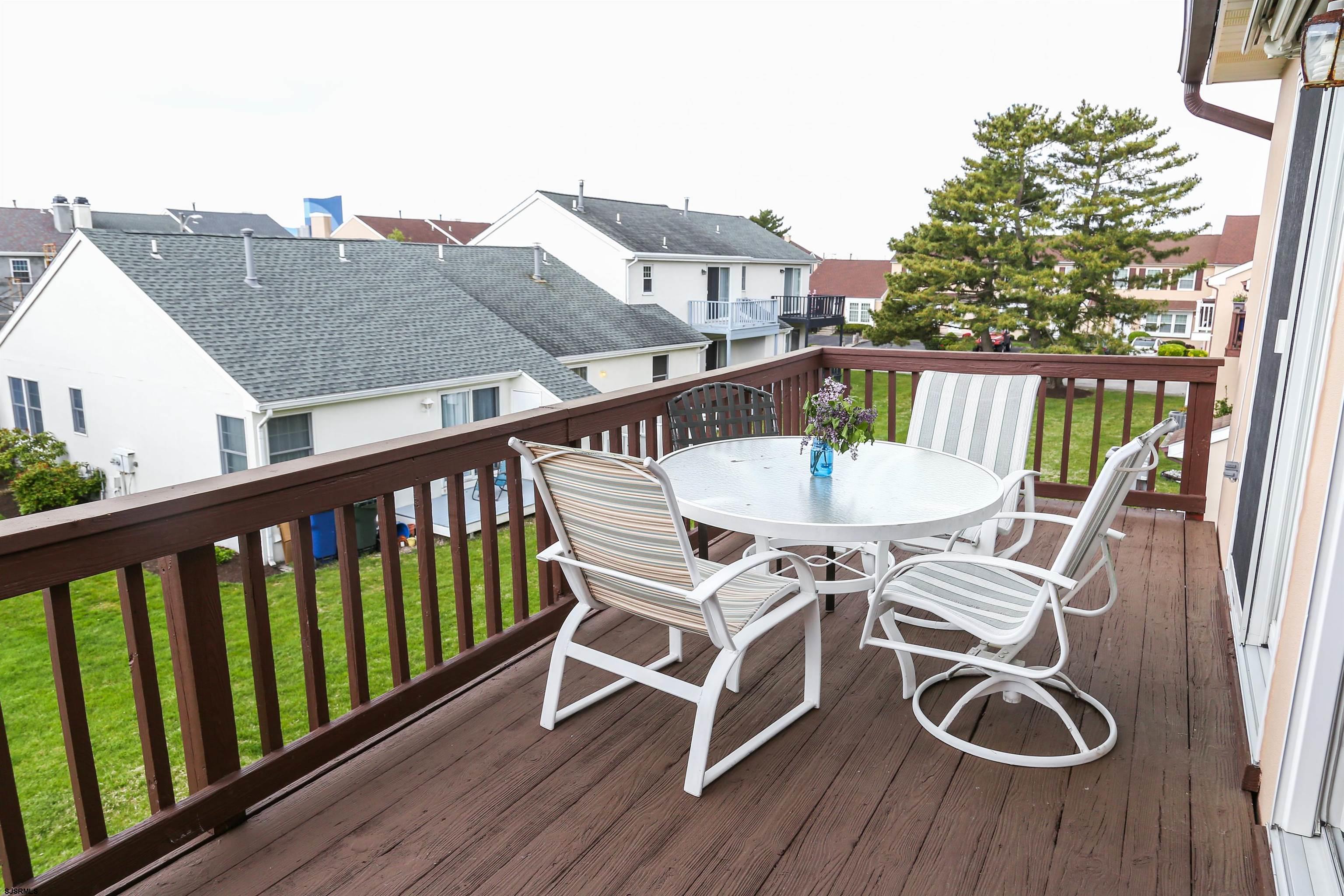340 Seashell Lane Brigantine, NJ 08203 - Photo 20 of 29 a view of a balcony with furniture and wooden floor