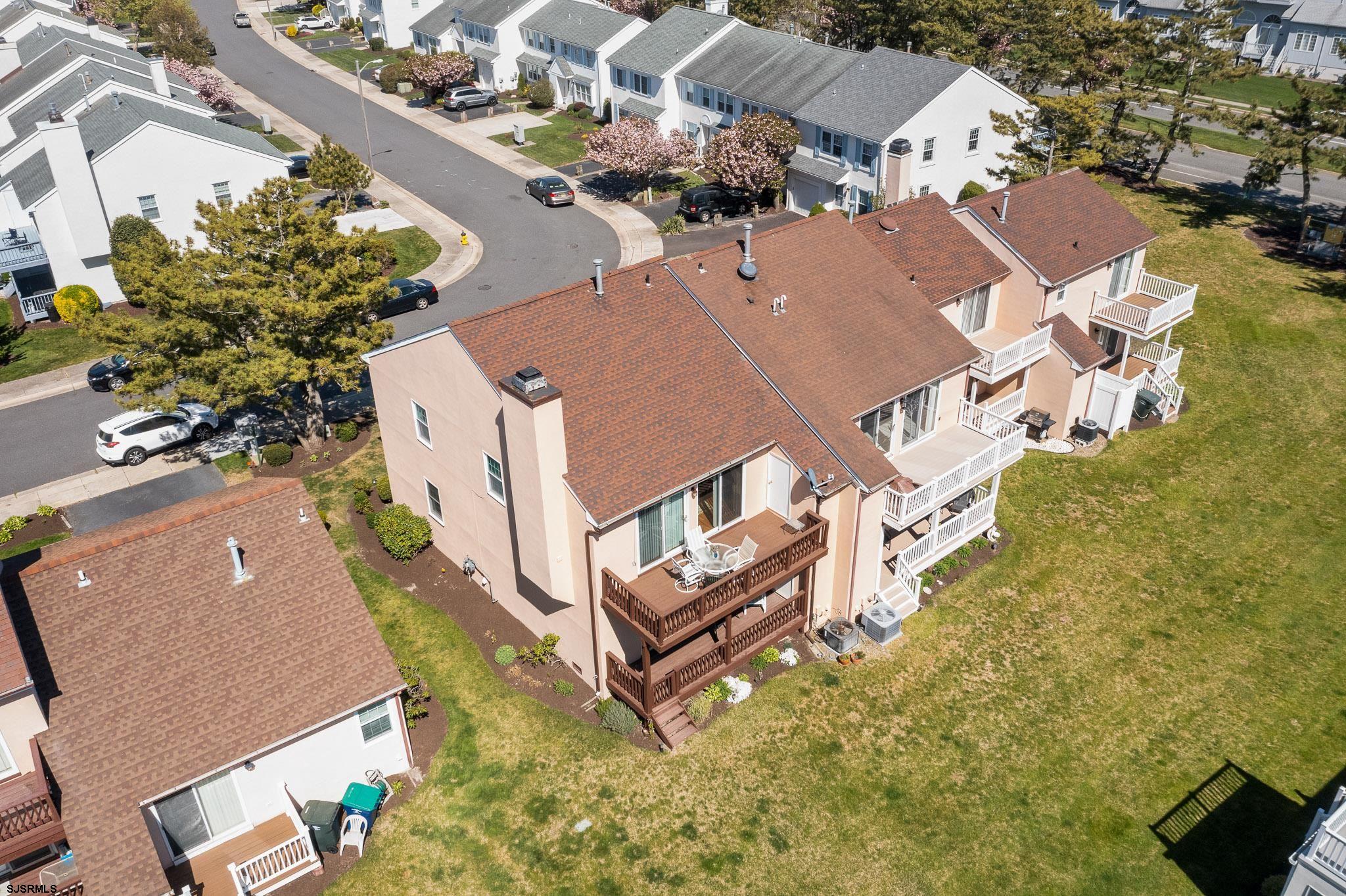 340 Seashell Lane Brigantine, NJ 08203 - Photo 2 of 29 an aerial view of a house with a yard and lake view